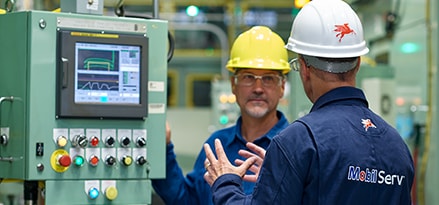 Mobil Serv engineers in factory