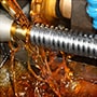 Machine gear with multifunctional soluble metalworking fluid