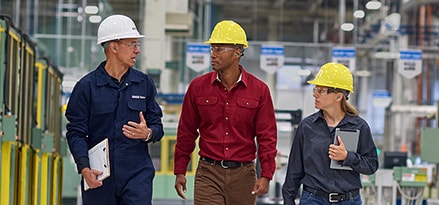 Mobil Serv workers walking in facility