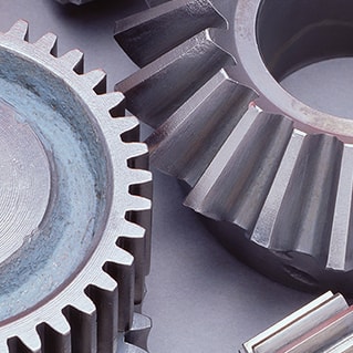 Grey industrial gears on table