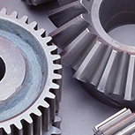 Grey industrial gears on table