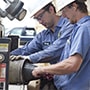 Two engineers working in factory