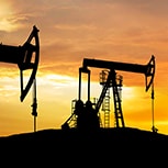 Two oil rigs in the sunset