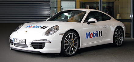 White Porsche car with Mobil 1™ logo on the hood