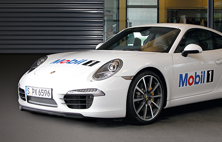 White Porsche car with Mobil 1™ logo on the hood
