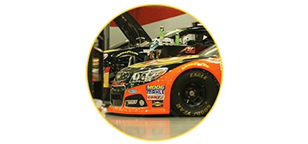 Nascar cars in garage