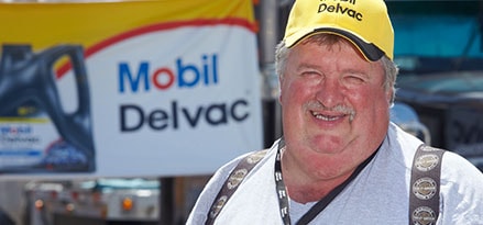 Tom Quinton interview with trucking advice in front of Mobil Delvac banner Tom Quinton interview with trucking advice in front of Mobil Delvac banner