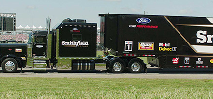 Black truck parked on road