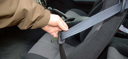 Keep car seat belt on while waiting for help