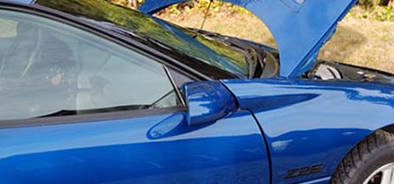 Lift vehicle hood to signal distress