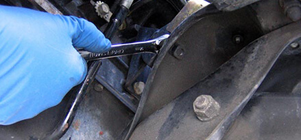 Lower engine and tighten bolts