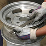 Use a flat file to smooth away curb rash on aluminum wheels