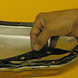 Mechanic installs new transmission filter