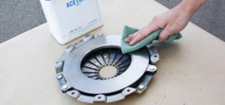 manual transmission clutch being cleaned