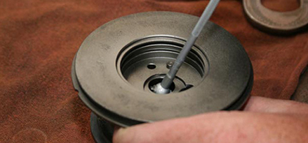 Turbocharger being cleaned and inspected