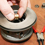 Turbocharger cartridge being assembled with bearings and seals