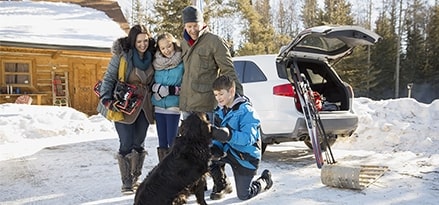 Family with car in snow