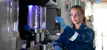 Mobil engineer looking at a lubricant sample