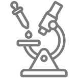 Microscope with a pipette dropping an oil sample onto a slide