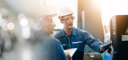 Mobil workers walking in facility