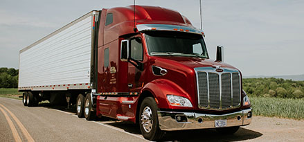 Truck on highway with red cab