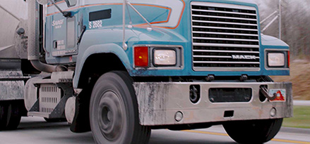 lower view of truck on highway with blue cab