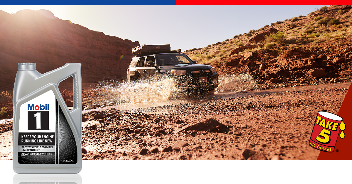 SUV driving on dirt road