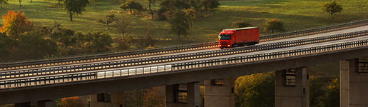 Semi truck driving across a bridge