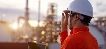 Worker with hard hat at industrial facility