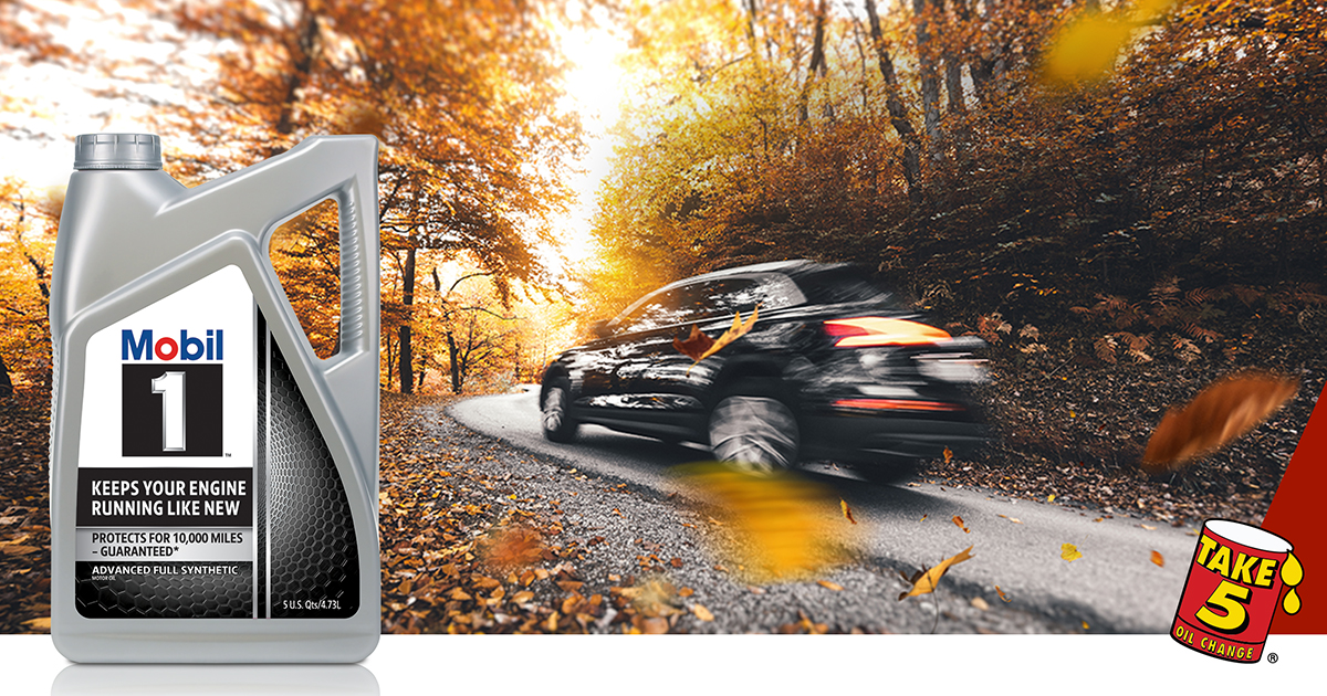 Car driving through the fall backroads.