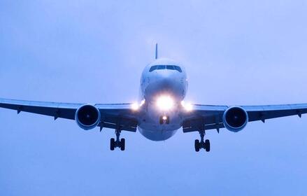 Front view of an approaching airplane