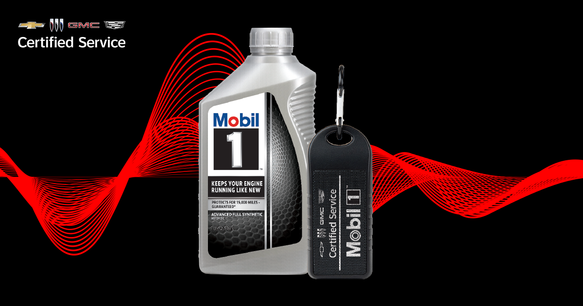 A bottle of Mobil 1™ motor oil and a black Bluetooth® speaker are locked up over a black background with red design elements behind them