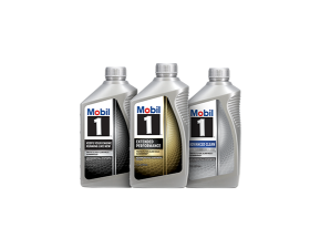 The image shows three silver plastic bottles of Mobil 1 motor oil standing side by side, the first one is of Mobil 1, the second one is of Mobil 1 Extended Performance, and the third is of Mobil 1 Advanced Clean