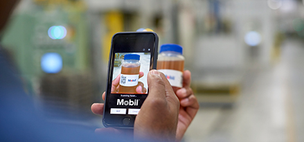 A customer using the MLA App to scan the QR code on a sample bottle