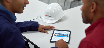 Customer with a Mobil technical expert talking though the options