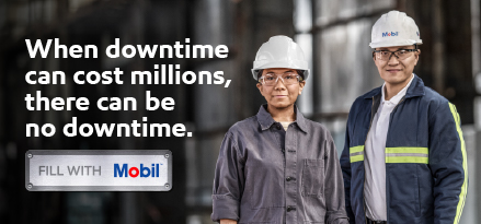 Two factory workers in safety gear stand in an industrial setting beside text reading “When downtime can cost millions, there can be no downtime,” with a Mobil-branded badge